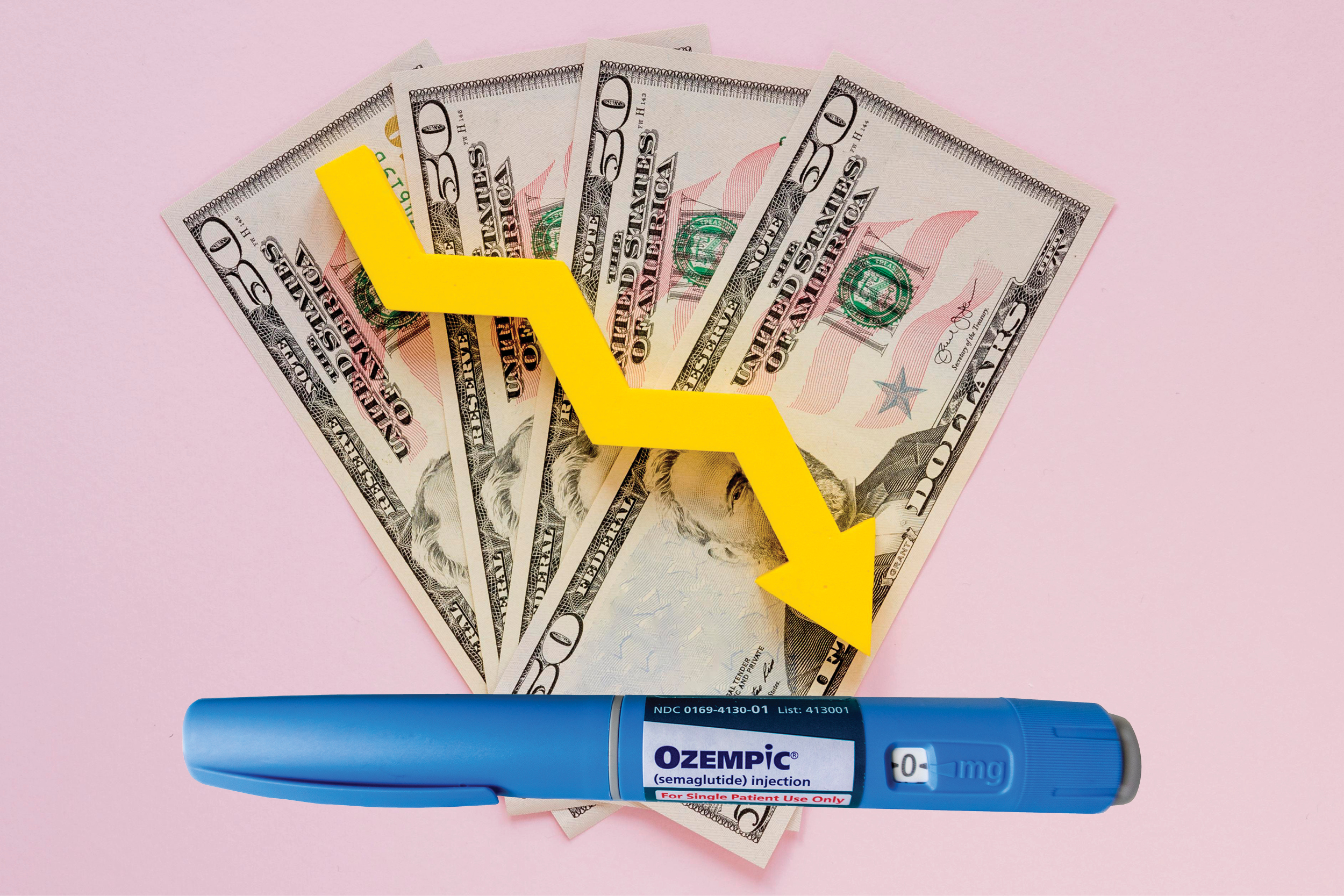 Downward symbol over money and ozempic weight loss injectable pen